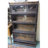 A Globe Wernwicke oak four tier stacking bookcase, 154cm high x 87cm wide x 35cm deep Condition