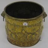 A hand beaten brass coal/log bucket Condition Report: Available upon request