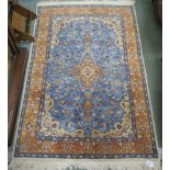 A blue ground Eastern rug with central medallion and matching border, 150cm x 94cm Condition Report: