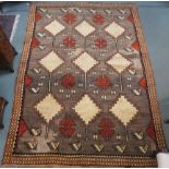 A Shiraz rug with stylized horse head design 290cm x 206cm Condition Report: Available upon request