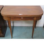 A 19th Century mahogany inlaid fold over tea table with a single drawer on square tapering legs,