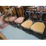 A pair of Queen Anne style walnut dining chairs, a pair of mahogany parlour chairs and two Victorian