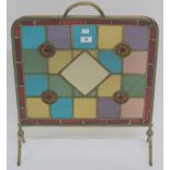 A brass firescreen with stained glass panels, 64cm high x 51cm deep Condition Report: