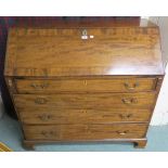 A Georgian mahogany inlaid bureau with fitted interior, four graduating drawers on bracket feet,