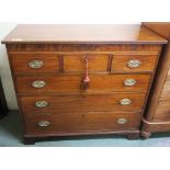 A 19th Century mahogany inlaid three over three chest of drawers on bracket feet, 106cm high x 118cm