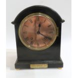 An ebonised dome top mantle clock with copper face, the mechanism marked W&H SCH, has key and