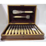 A lot comprising a cased fish cutlery set, a swing handled basket & a toast rack Condition Report: