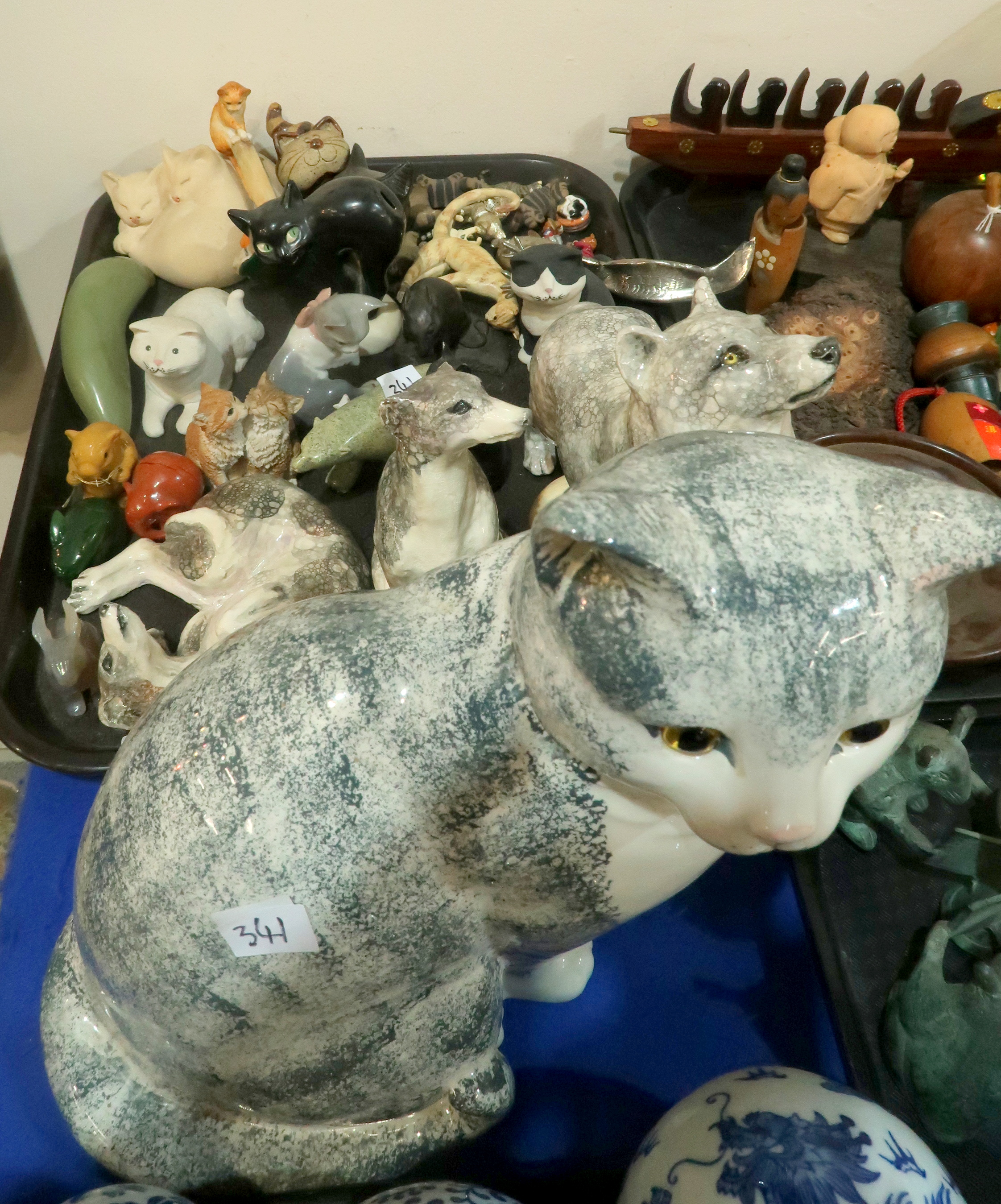 A lot comprising a Staffordshire model of a cat with glass eyes, examples by Lladro & Border Fine