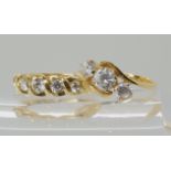 A 14k gold cz three stone ring size O1/2, and a five stone cz ring, size N, weight combined 4.4gms