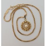 A 9ct gold pearl set flower pendant and chain, length of chain 40cm, weight 10.4gms Condition