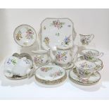 A Shelley Wild Flowers teaset, comprising six cups, saucers and side plates, two jugs of varying