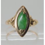 A 14k gold Chinese green hardstone ring size L1/2, weight 3.4gms Condition Report: Available upon