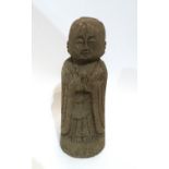 A carved stone figure of a Buddha Condition Report: Available upon request