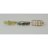 A 9ct gold peridot and diamond ring size O1/2, a white opal and diamond accent ring size O1/2, and a