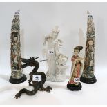 A blanc de chine figure of a woman, a metal dragon, a pair of resin tusks carved with figures and