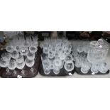 A lot comprising a selection of cut glass & crystal drinking glasses, a glass biscuit barrel etc