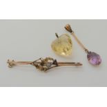 A 9ct gold gem set thistle brooch, a 9ct amethyst drop pendant and a citrine heart pendant, weight