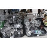 A lot comprising a quantity of cut glass & crystal drinking glasses, many with etched & floral