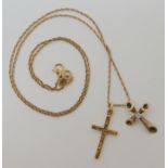 Two 14k gold crosses one set with a diamond with a 14k gold chain weight together 4gms Condition