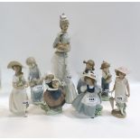 A collection of Nao and Lladro figures and one other figure Condition Report: All in good condition.