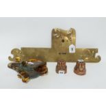 A brass door finger plate, two copper moulds and a glass frog Condition Report: Available upon