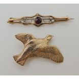 A 9ct gold grouse brooch, together with a 9ct red gem set brooch, weight combined 8.2gms Condition