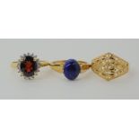 A 9ct gold garnet and diamond ring, size N, 9ct lapis lazuli ring, size P, and a 9ct dome ring