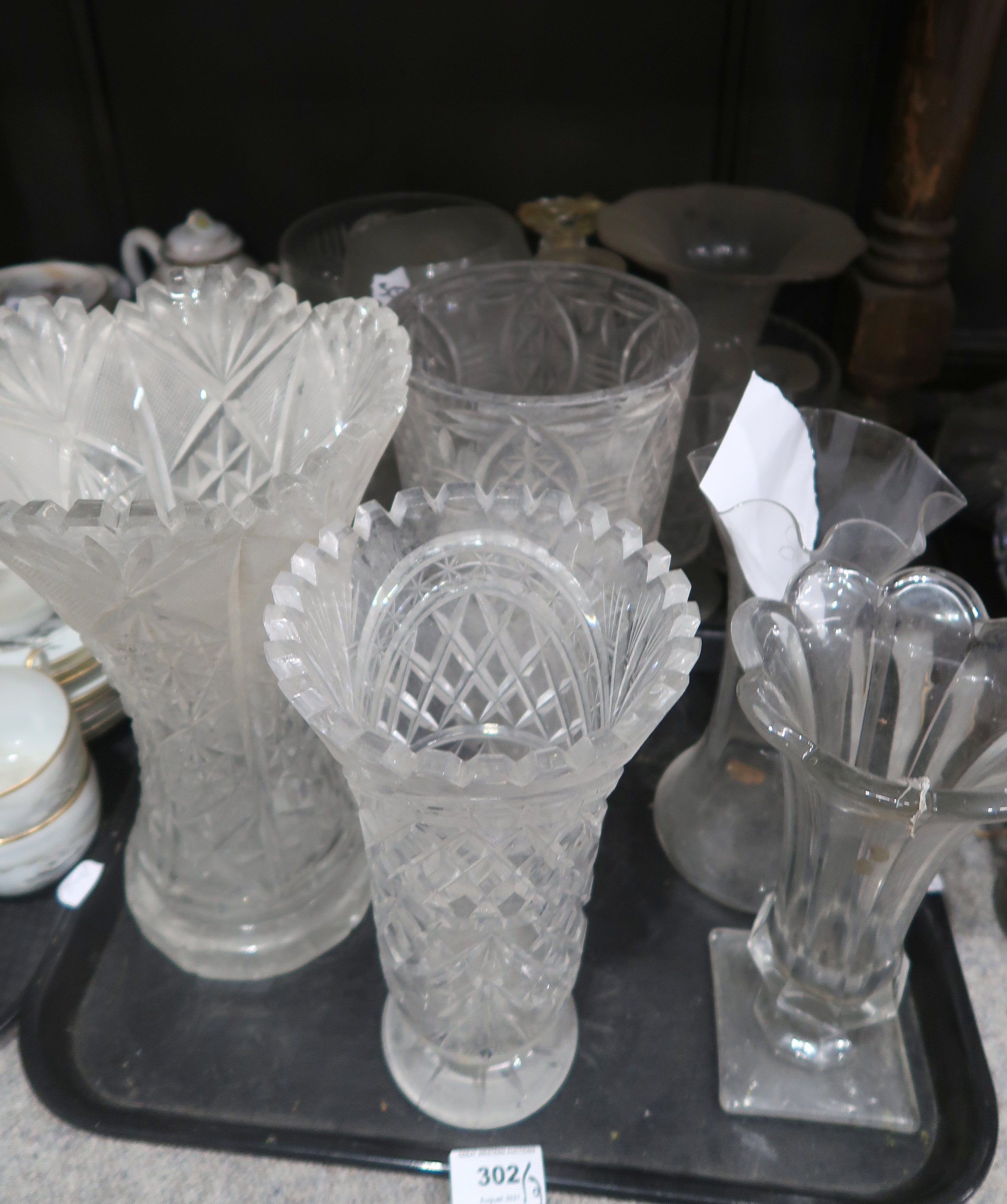 A lot comprising a quantity of cut glass & crystal, including press moulded vases, tazzas,