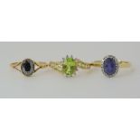 A 9ct gold iolite and diamond ring, size O1/2, 9ct peridot and diamond ring, size N1/2, and a