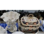A Moore's white glazed cherub centre piece and an imari pattern soup tureen, cover and stand