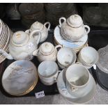 A lot comprising a selection of 20th century Japanese eggshell porcelain tea services, decorated