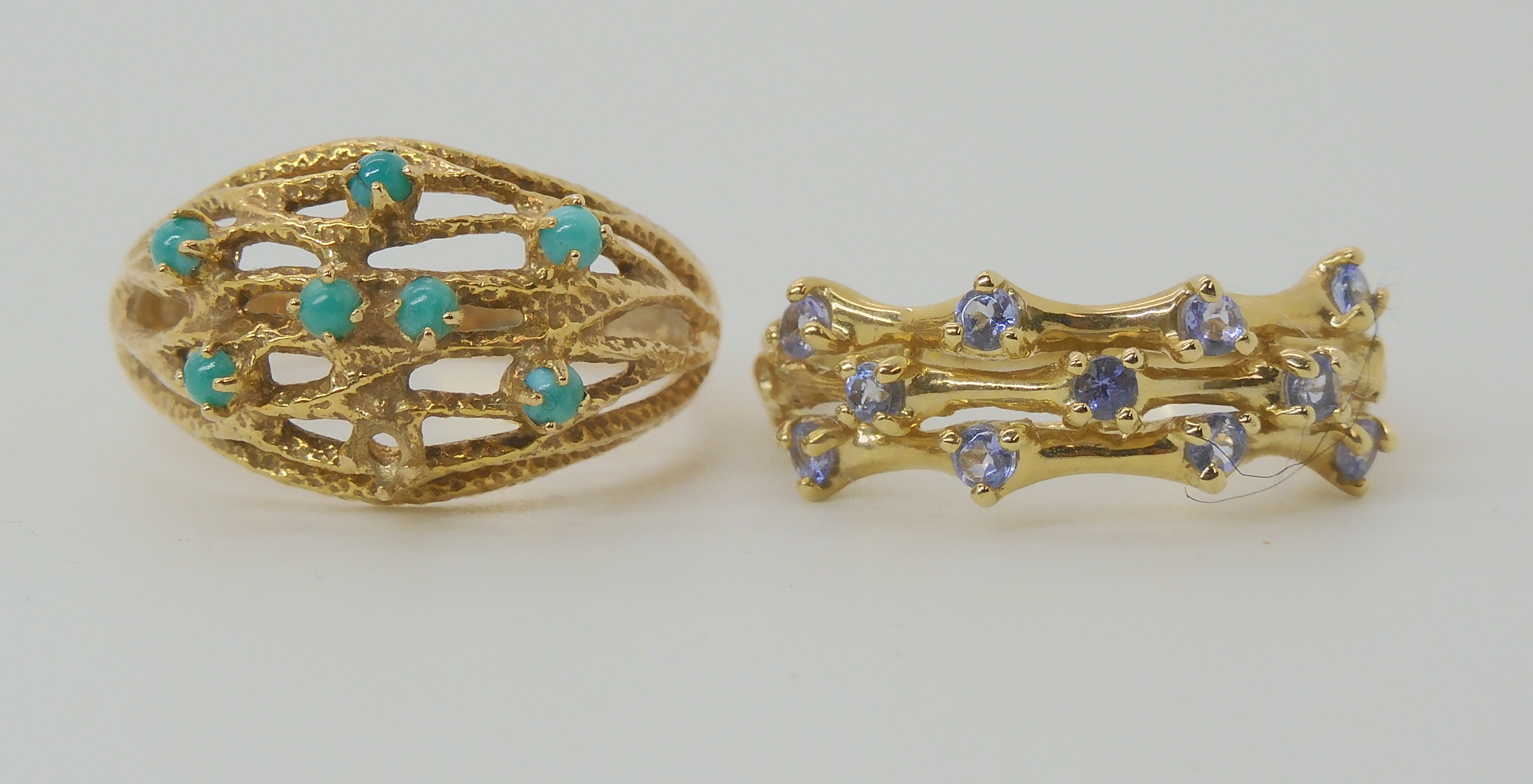 A 9ct gold dome ring set with turquoise (one missing) size P1/2, and a 9ct three strand ring set