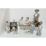 A collection of Lladro figures including Practice makes perfect, modelled as a girl at a piano, tree