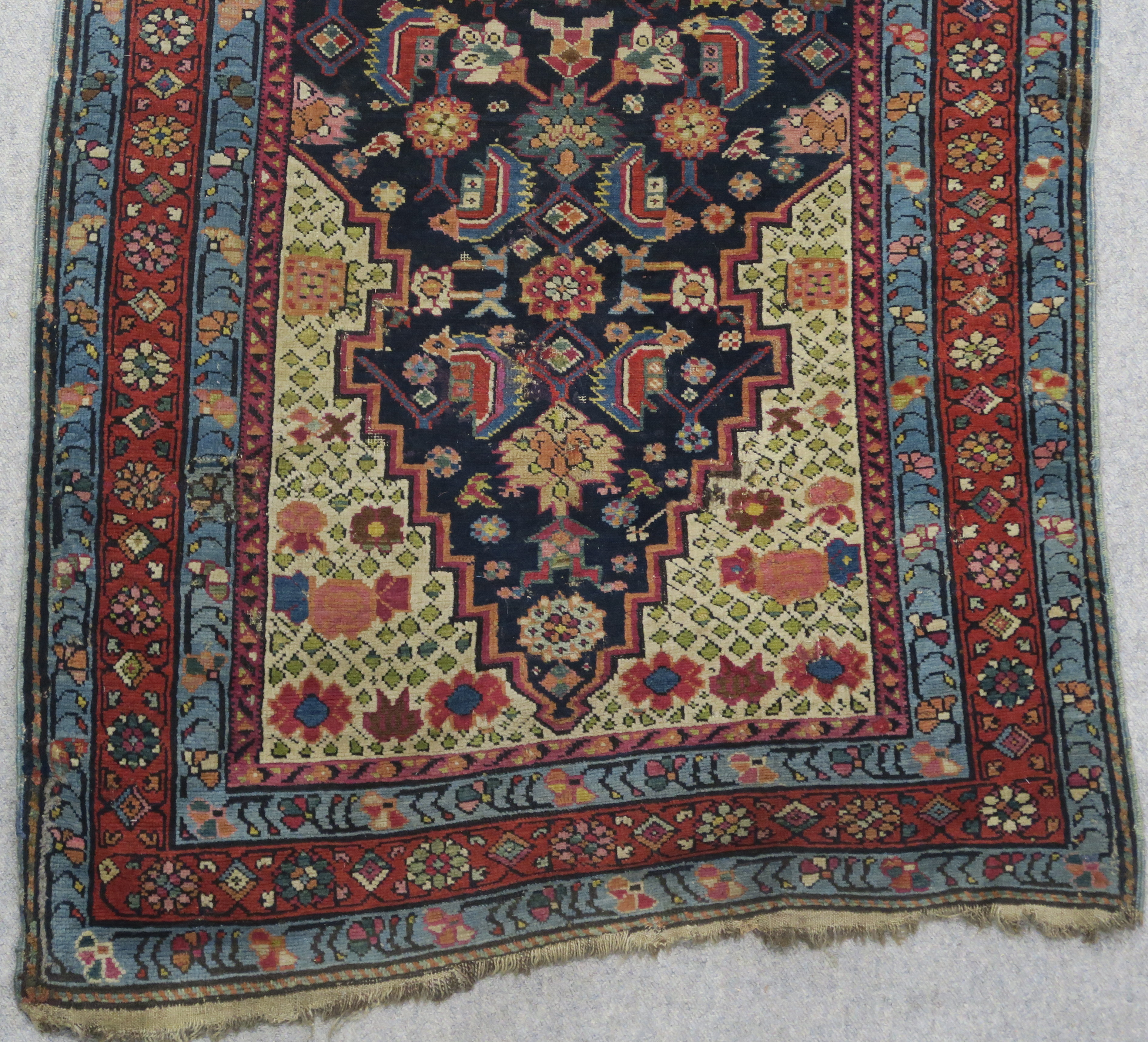 AN INDIGO GROUND PERSIAN RUNNER, with an allover geometric design, cream spandrels within blue and - Image 2 of 12