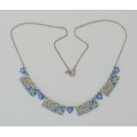 AN ENAMEL PLAQUE NECKLACE ATTRIBUTED TO BERNARD INSTONE with multi colour flower enamel links.
