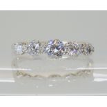 A FIVE STONE OLD CUT DIAMOND RING mounted in 18ct white gold and platinum, the five diamonds