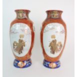 A PAIR OF ARITA BALUSTER VASES each painted with panels figures and flowers within a red and gilt