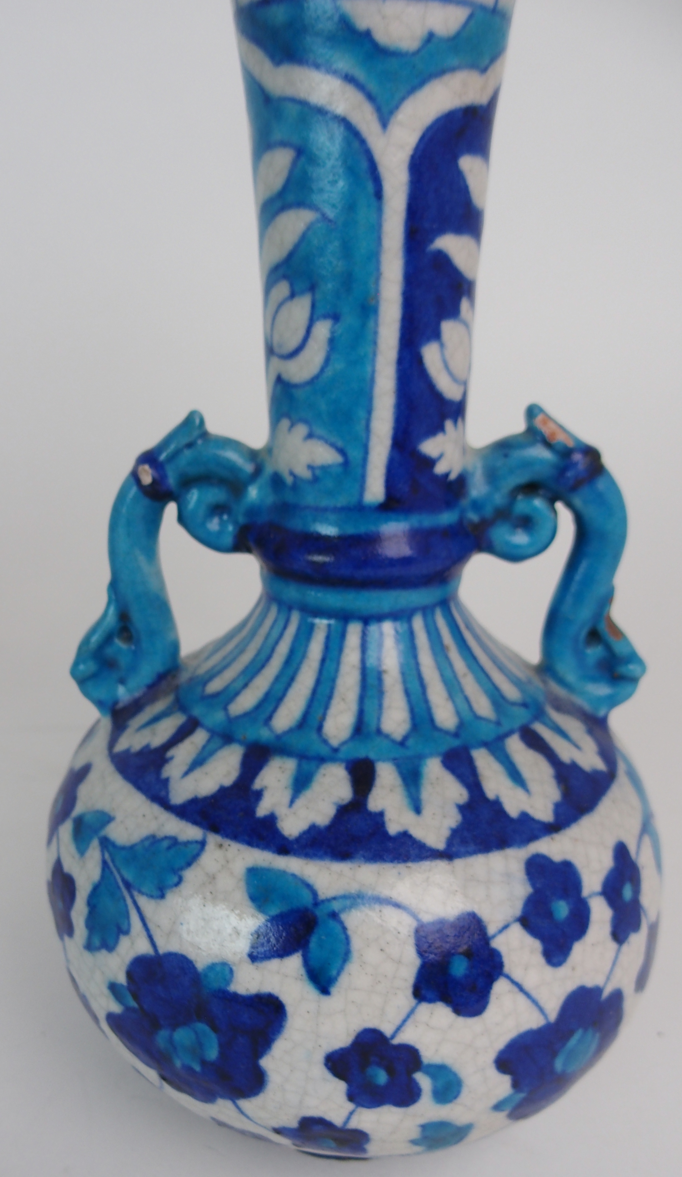 A PAIR OF PERSIAN POTTERY BLUE AND WHITE TWO HANDLED VASES painted with flowers and foliage, with - Image 7 of 11