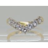 AN 18CT GOLD 'V' SHAPED DIAMOND RING set with estimated approx 0.70cts of brilliant cut diamonds,