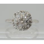 AN 18CT WHITE GOLD DIAMOND CLUSTER RING set with estimated approx 0.60cts of old cut diamonds,