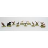 A BOXED SET OF FOUR COLD PAINTED SPELTER DOG NAME HOLDERS upon onyx and chrome bases, 4cm