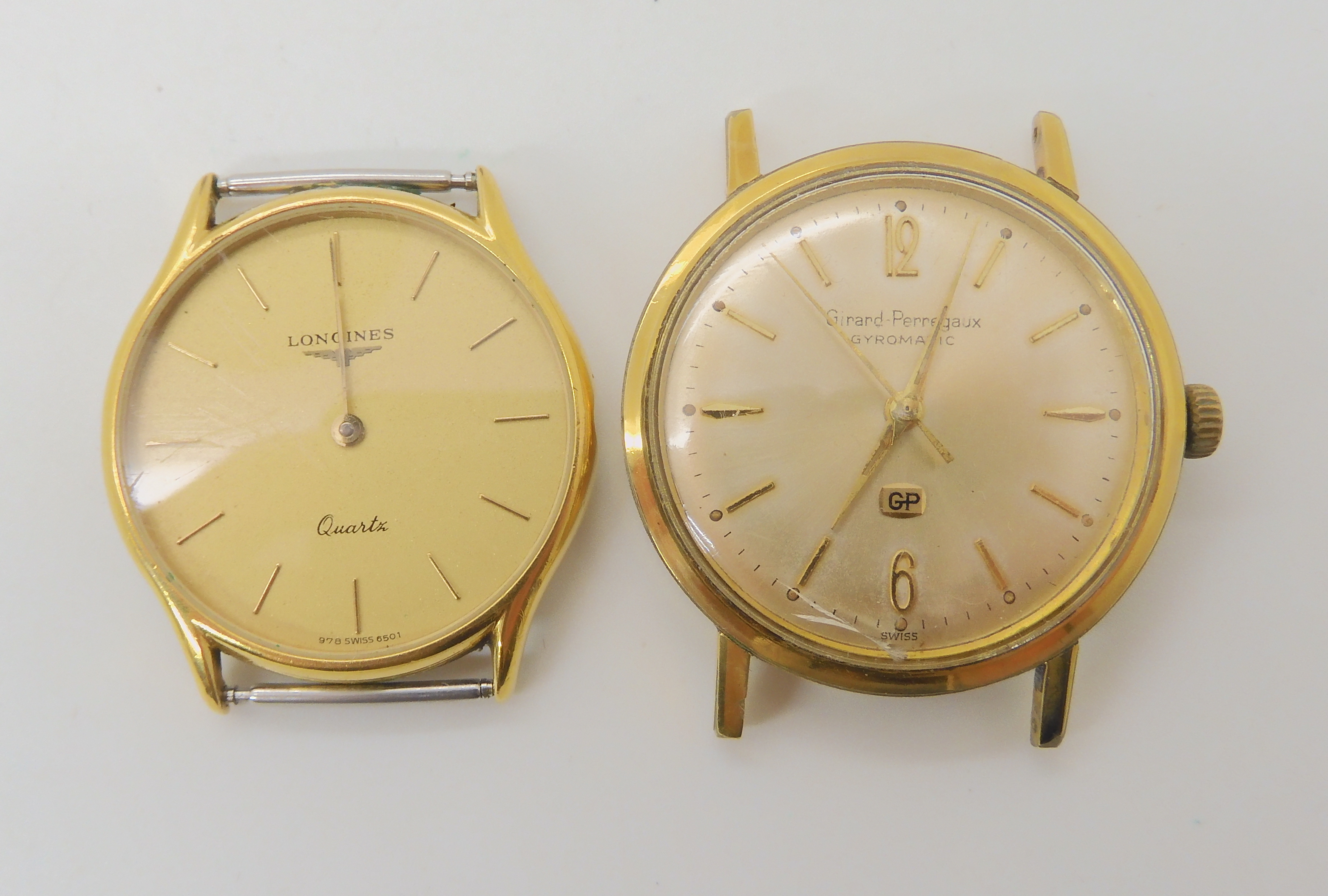 GIRARD PERREGAUX WATCH HEAD AND A LONGINES a gold plated Girard Peregaux Giromatic, with a cream