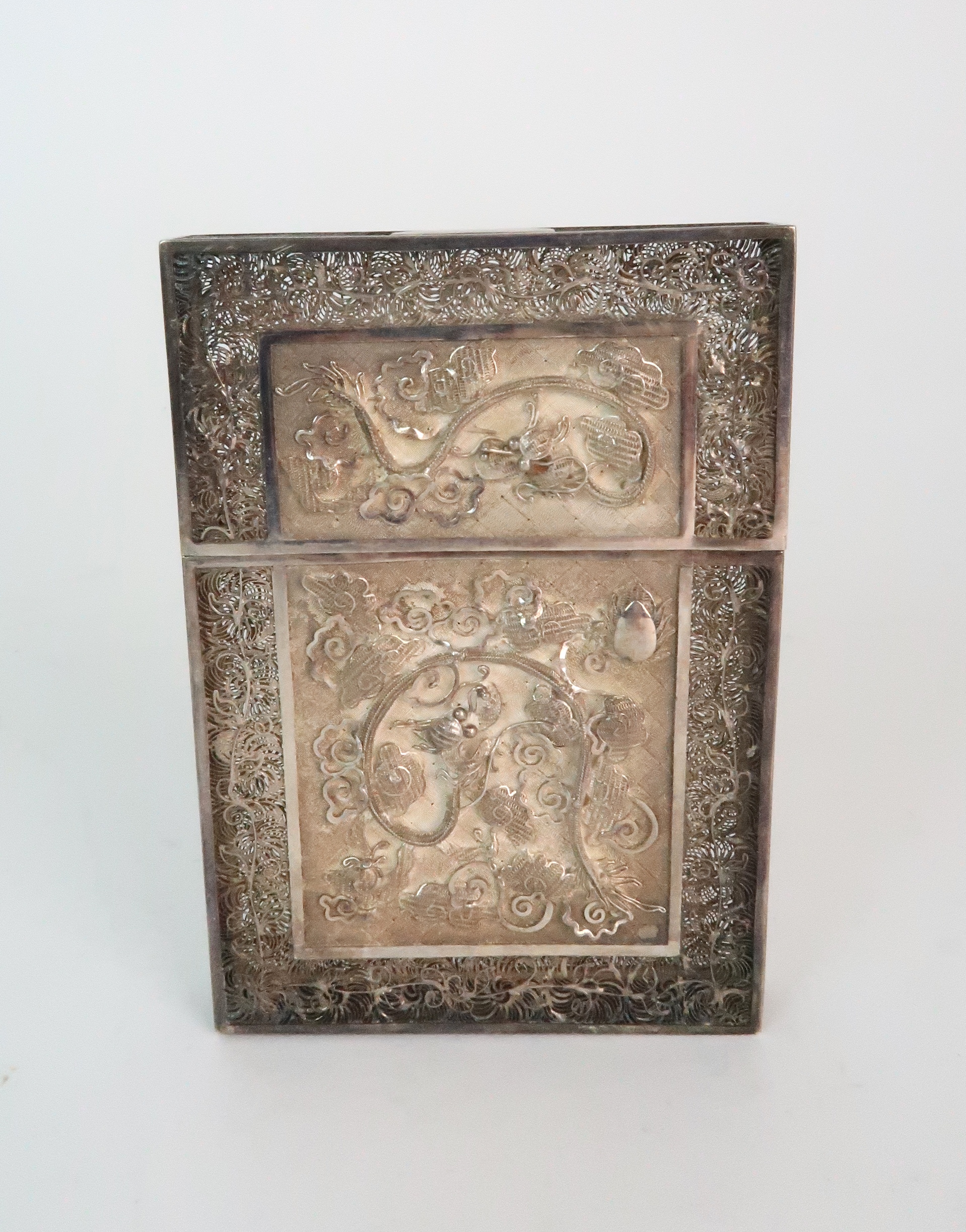 A CHINESE EXPORT SILVER CARD CASE finely decorated with snakes and dragons, foliage and insects,