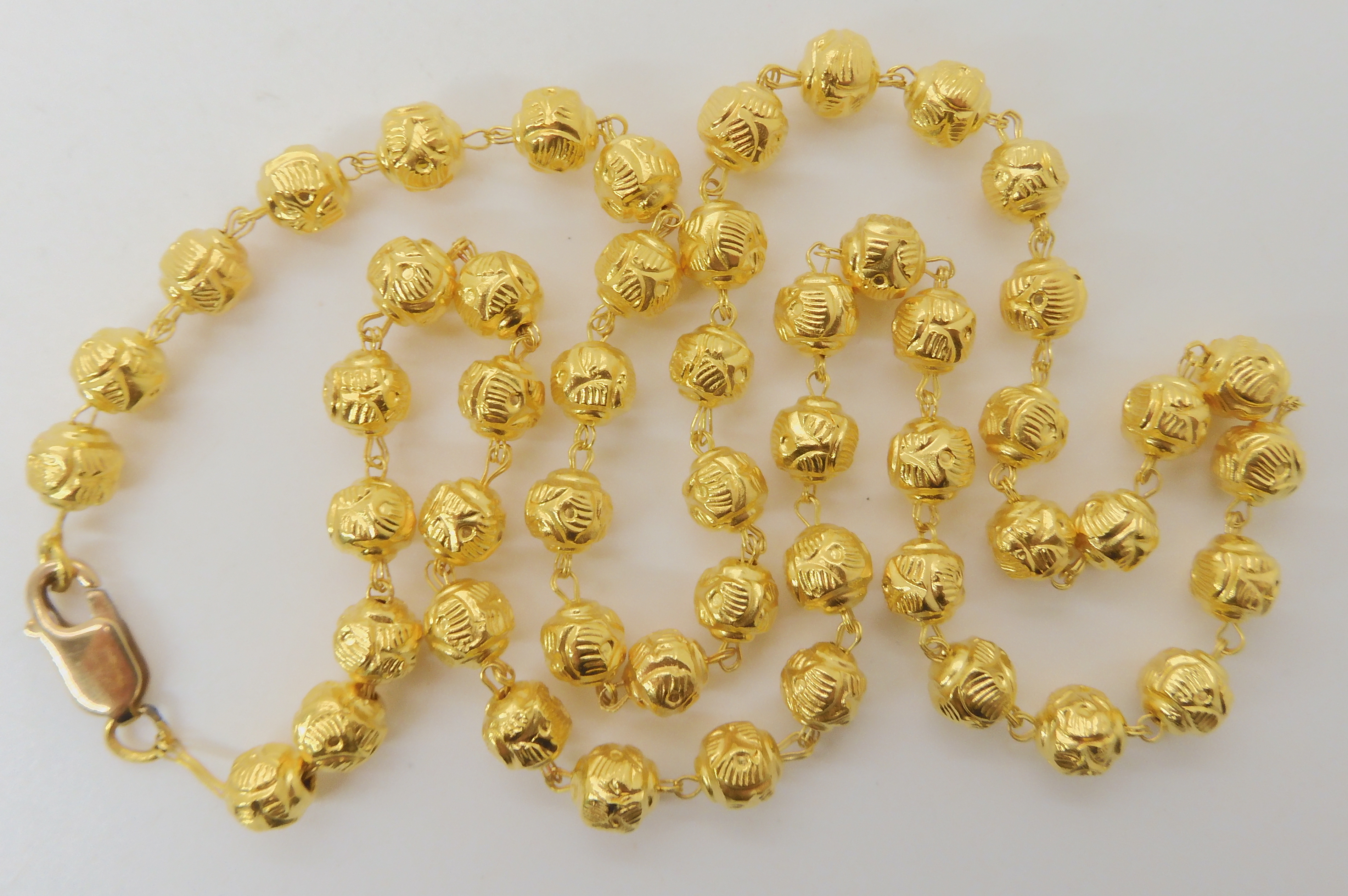 A BRIGHT YELLOW METAL BEAD NECKLACE, AND BRACELET bead necklace, is bright yellow metal with a UK, - Image 5 of 5