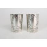 A PAIR OF RUSSIAN SILVER VODKA CUPS probably by Alexander Korder, St. Petersburg c1850, marked