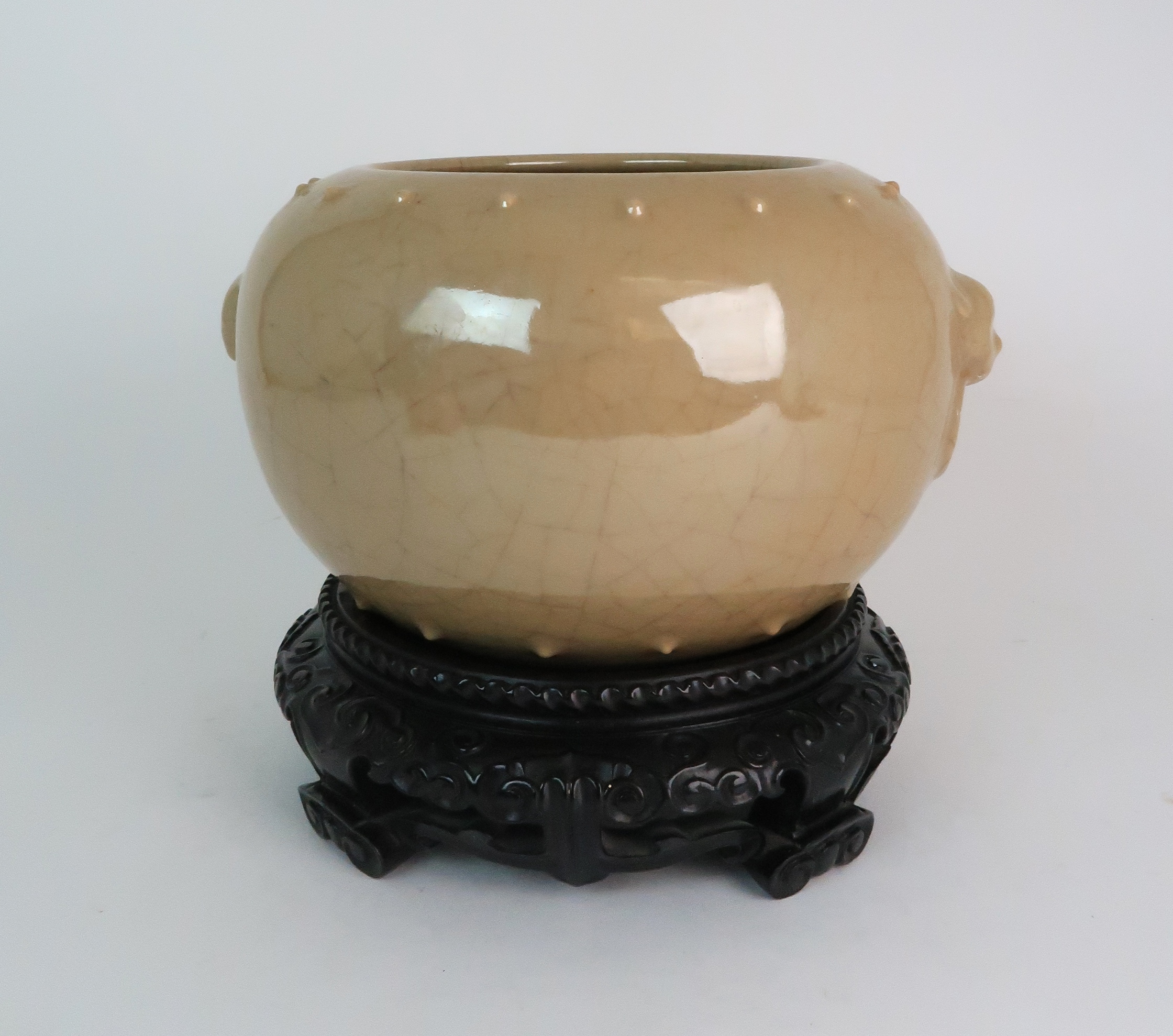 A CHINESE CELADON CRACKLWARE BOWL modelled with ring mask handles, within two rows of studs, 15.
