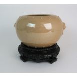 A CHINESE CELADON CRACKLWARE BOWL modelled with ring mask handles, within two rows of studs, 15.