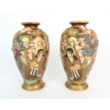 A PAIR OF SATSUMA BALUSTER VASES each applied with sinuous dragons coiled around the bodies and