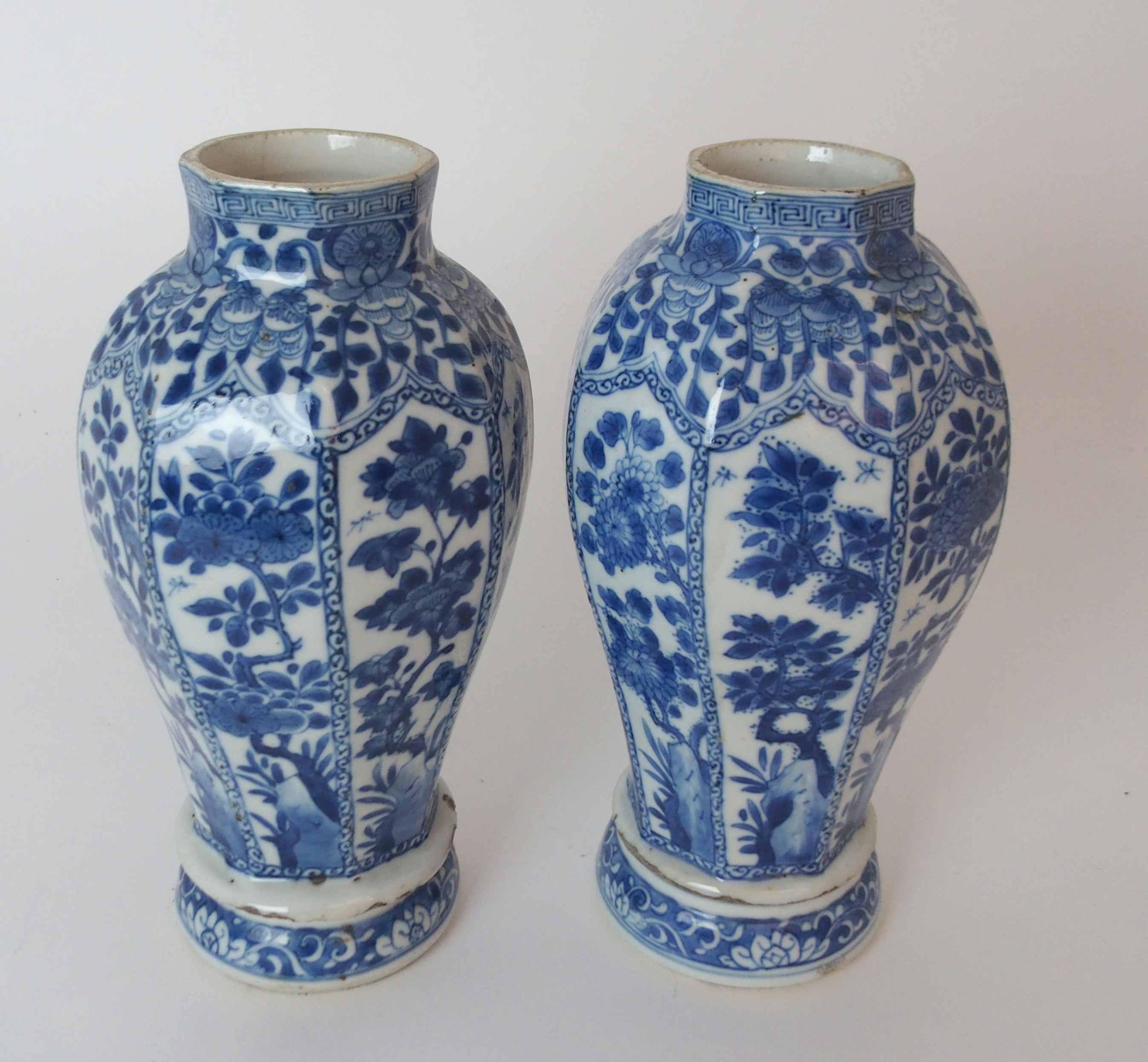 A PAIR OF CHINESE BLUE AND WHITE OCTAGONAL VASES each painted with panels of insects amongst foliage