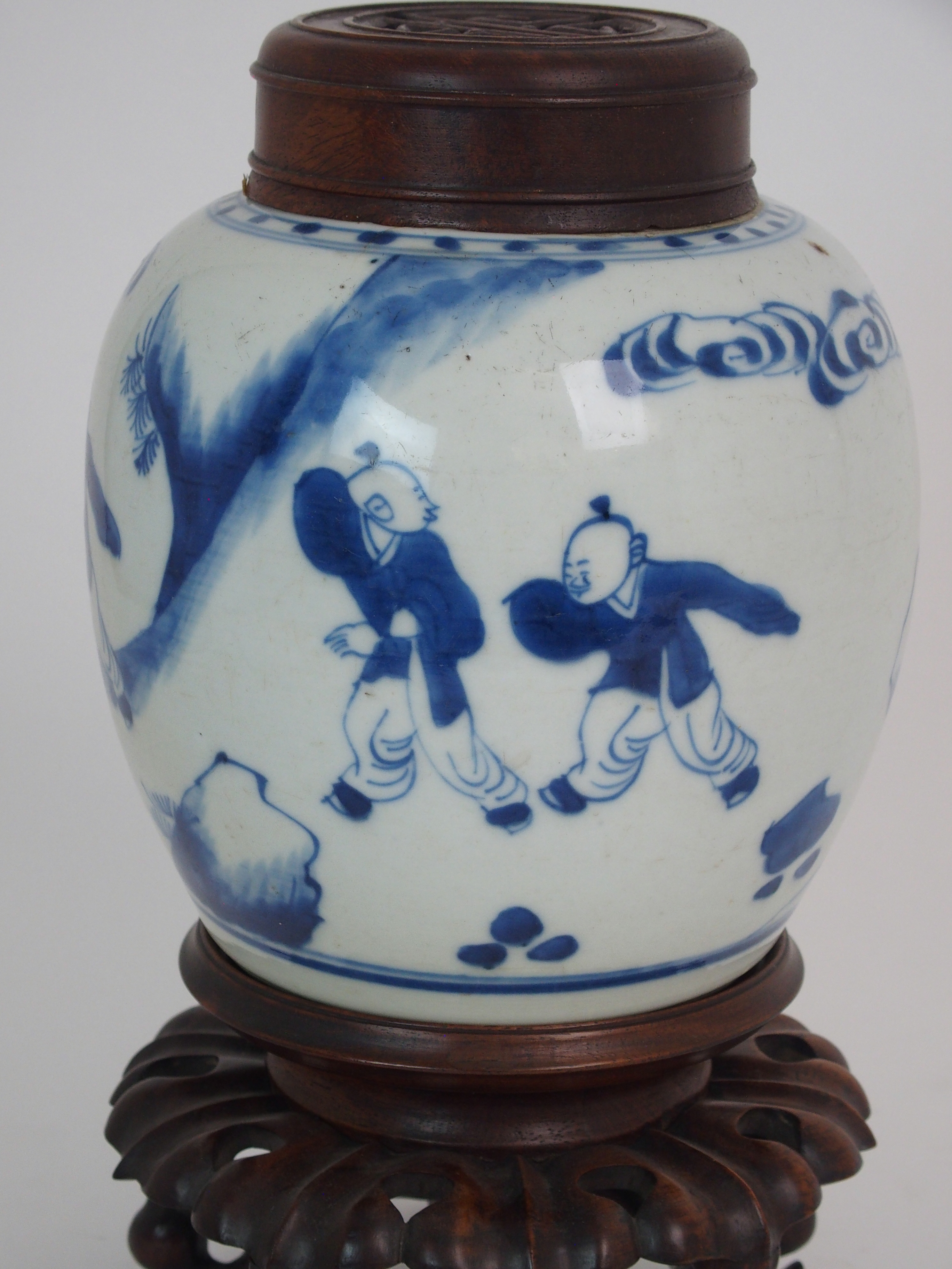 A CHINESE BLUE AND WHITE GINGER JAR painted with children at play, 15.5cm high, wood stand and cover - Image 2 of 7